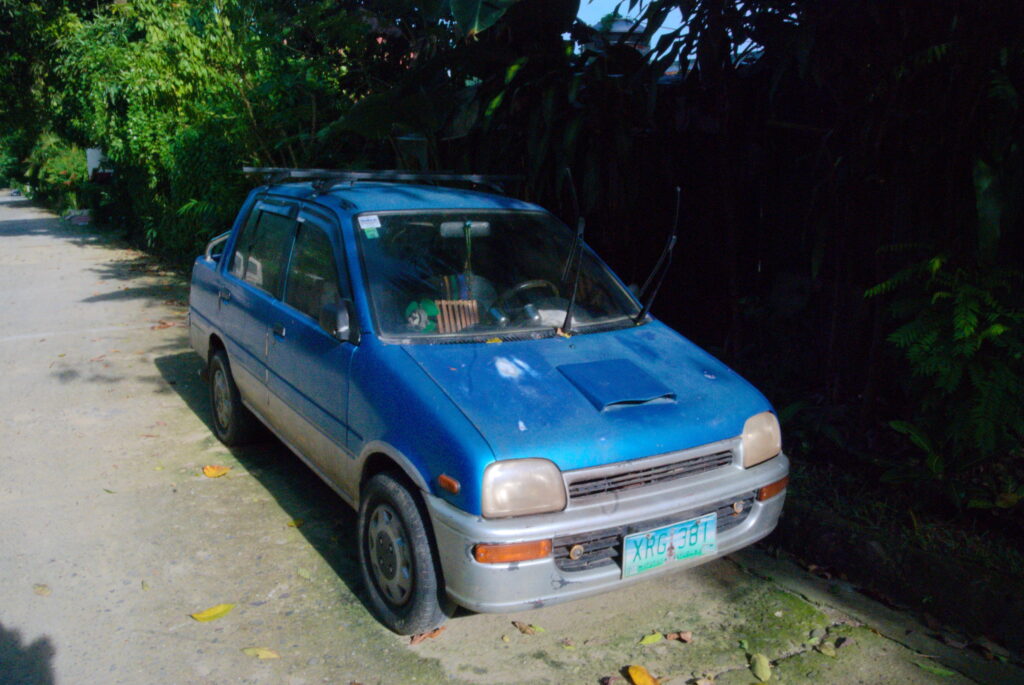 Old Kia car blue